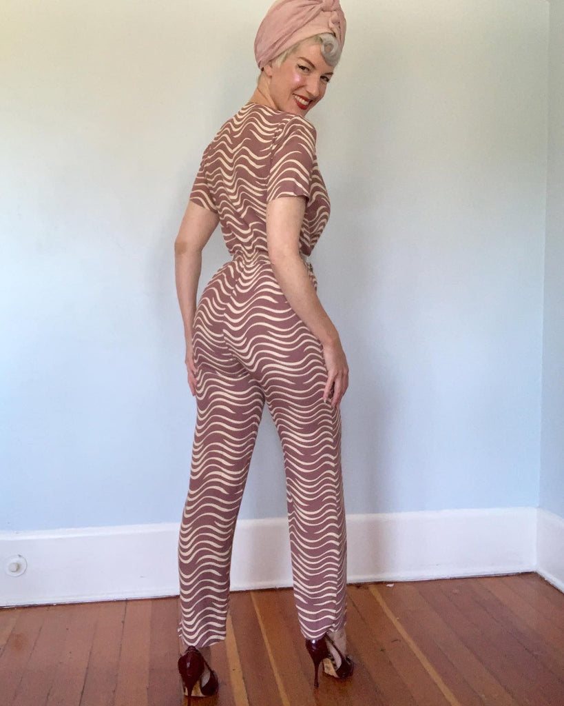 cigarette jumpsuit ACA Rare 1970s Print Jersey Wayward Collection featuring a slim and stylish cigarette pant style with an opening at the ankle Fitted jumpsuit, cigarette bottom.